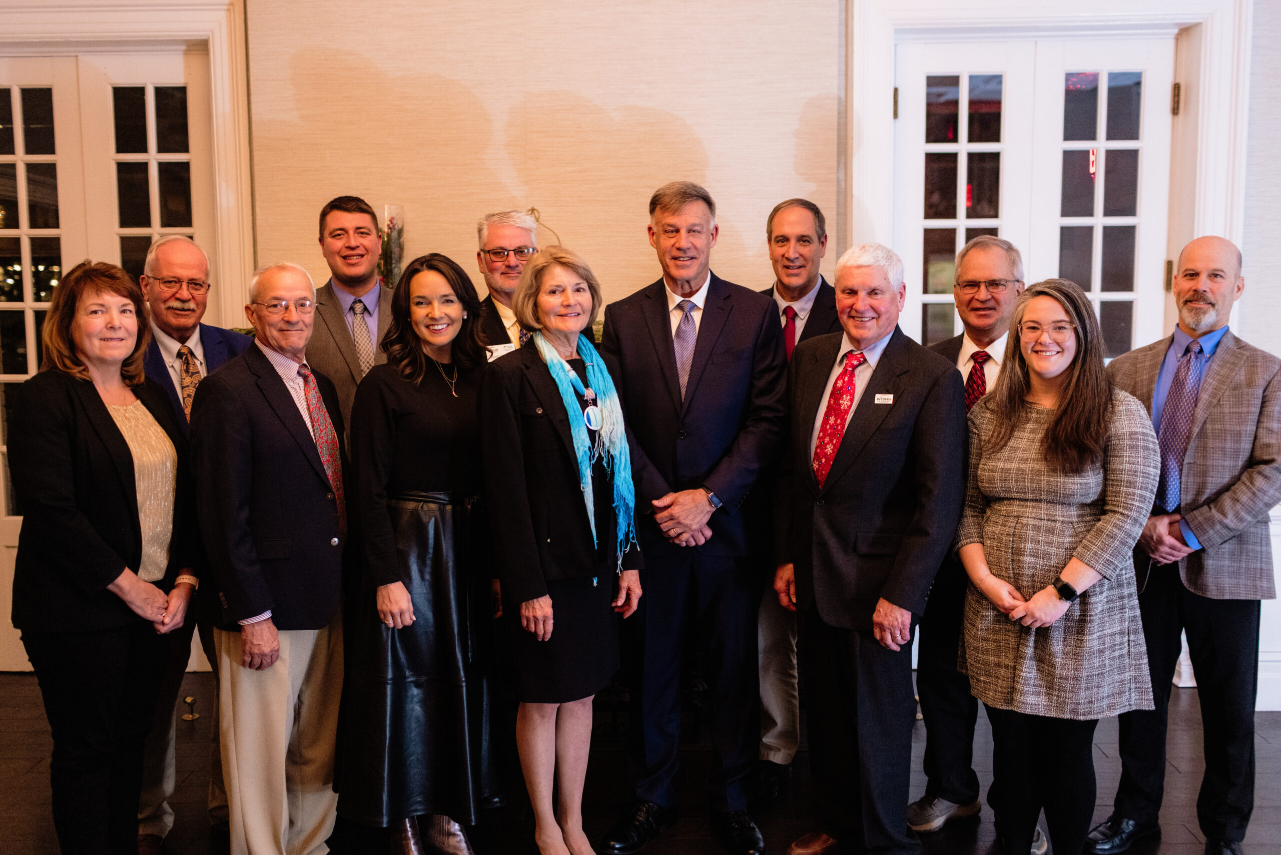 U.S. Naval Academy Vice Admiral (retired) Sean Buck is pictured with members of the WISHH program committee.