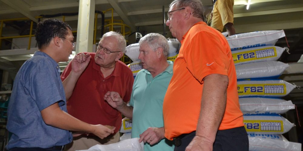 Rady Chea, general manager of the first feed mill in Cambodia to add a manufacturing line for fish feed, discusses soy protein with USB Director & WISHH Ex-Officio Member David Williams of Michigan, ASA Director and WISHH Program Committee Member Morey Hill of Iowa, and WISHH Program Committee Member and Past Missouri Soybean Merchandising Council Chair David Lueck.
